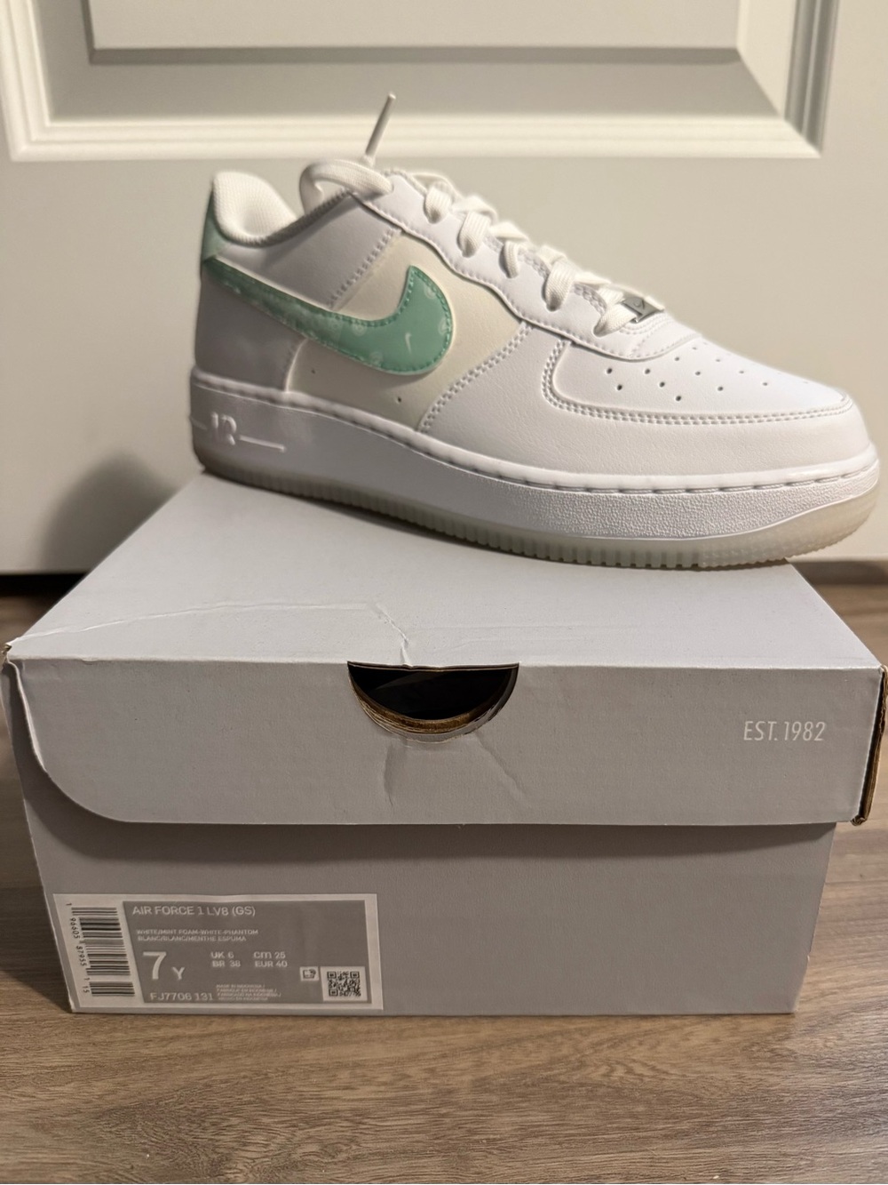Nike Kids White Sneakers with Mint Green Swoosh Accent